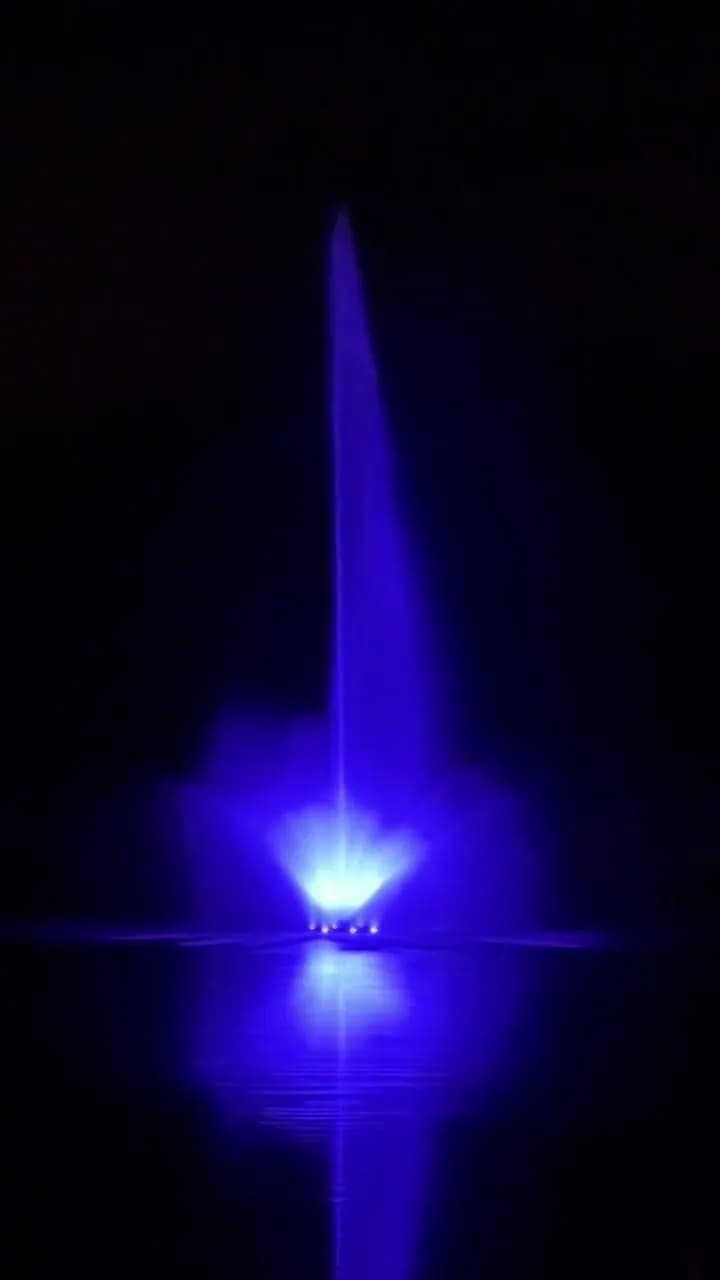 20 HP AquaMaster fountain at night with color-changing lights. The center jet reaches about 70 feet. It is the tallest fountain in Indiana.